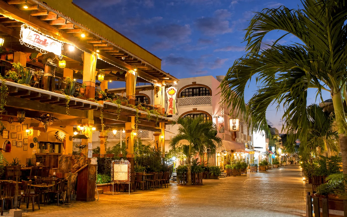 5th Avenue in Playa del Carmen with restaurants, lights, and a walkable evening atmosphere